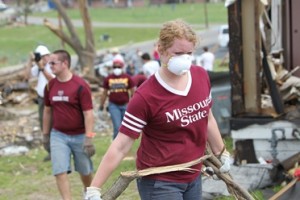 A student volunteers with relief efforts in Joplin.