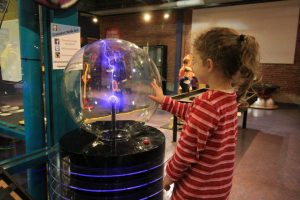Girl experimenting at Discovery Center