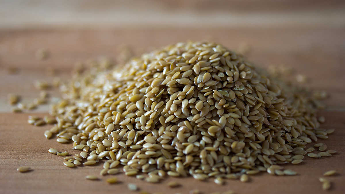 A pile of golden flaxseeds
