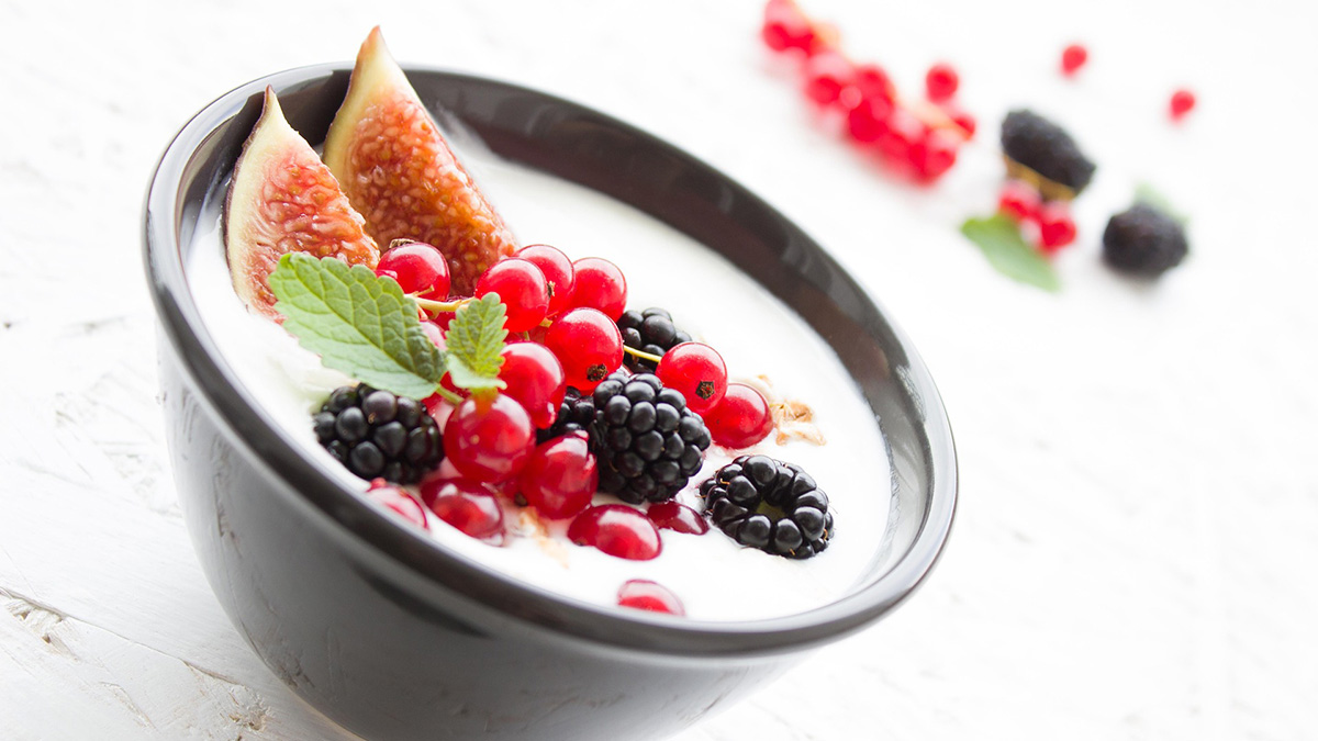 A bowl of yogurt with fresh fruits