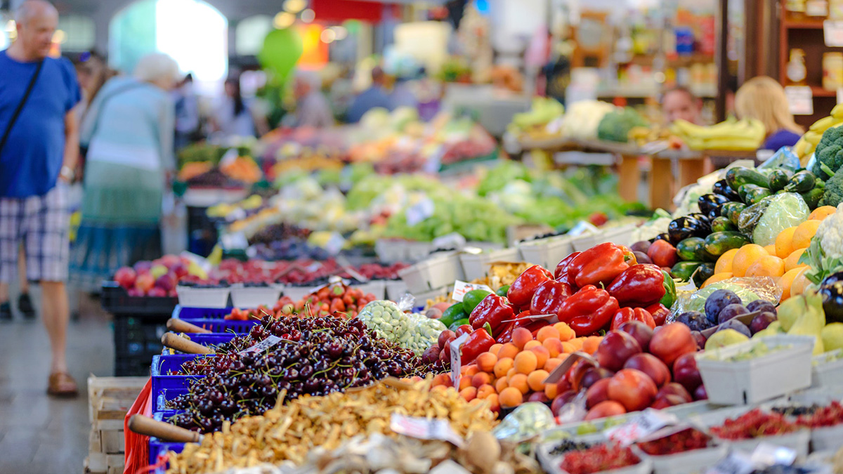 Fruits and vegetables stalls at a market.