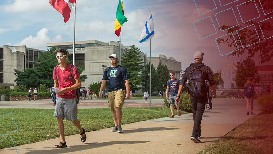 MSU students walk past international flags on campus
