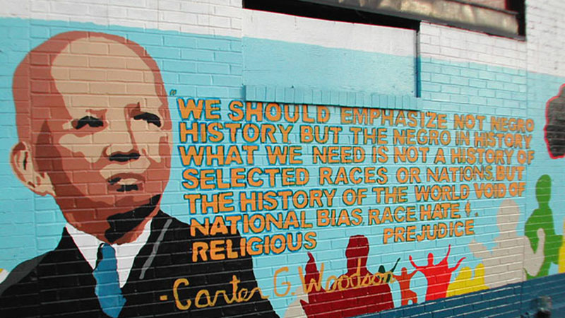 A mural of Carter Woodson and his quote on Black history.