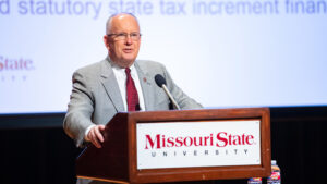 Clif Smart speaks behind a Missouri State podium.