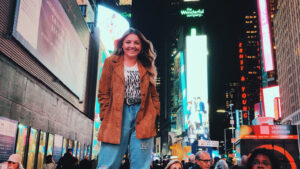 Katie Sulzner standing in Times Square in New York.