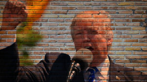 An image of President Donald Trump on a brick wall.