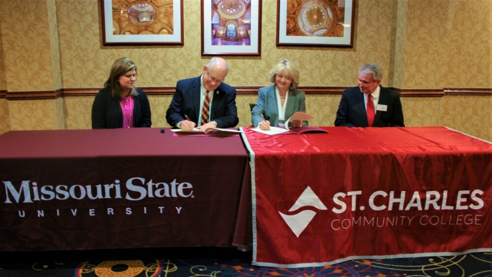 MSU President Clif Smart signs the agreement.