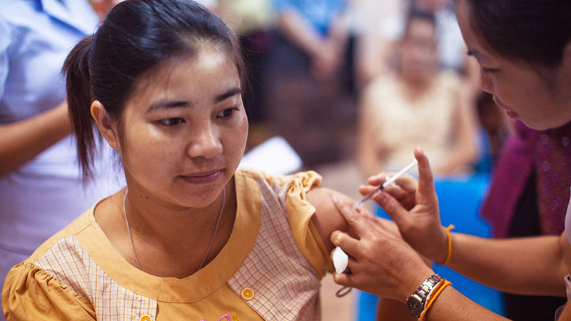 A woman getting vaccinated.