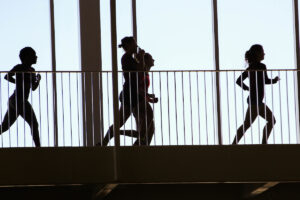 Silhouette of runners on track
