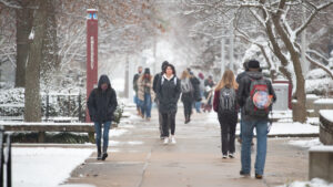 Students walk on campus in the snow