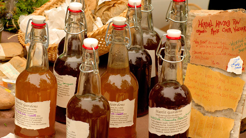 Glass bottles filled with apple cider vinegar.