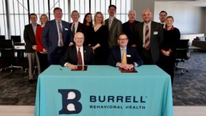 Missouri State and Burrell representatives celebrate the signing of the MOU.