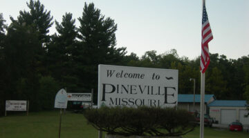 A Welcome to Pineville, Missouri signage.