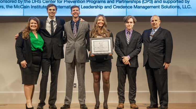 Ad Team accepts award. Left to right: Samantha Francka, Matthew Richner, Chandler Revie, Lilly Churan, Adrian Fruge, and John Picarelli (DHS dir. of Center for Prevention Programs and Partnerships).