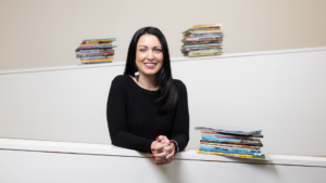 Dr. Kayla Lewis with books.