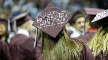 A graduation hat bejeweled with the year 2023