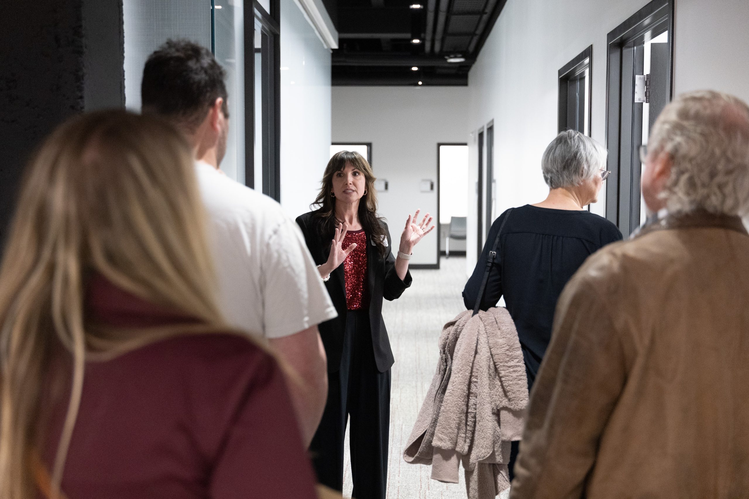Lauren Jones leads a tour during the grand opening of the Collaborative Care Clinic on Feb. 20.