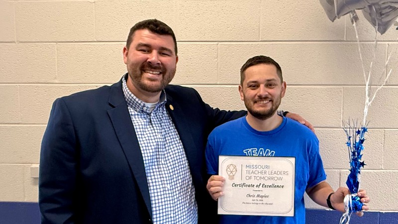 Chris Maples (right) receives his award from Dallas DeWeese, member of the Missouri Milken Educators and Hollister School District assistant principal.