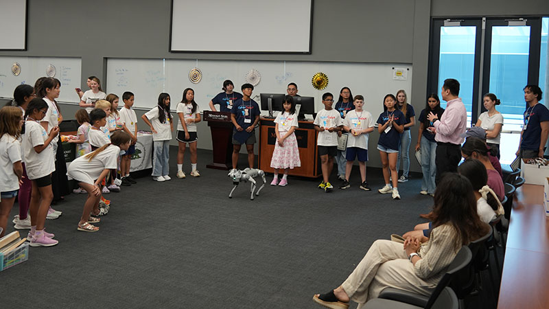 Dr. Xiang Guo, department head of information technology and cybersecurity, leads an activity for campers at this summer’s Cyber Cubs camp on campus.