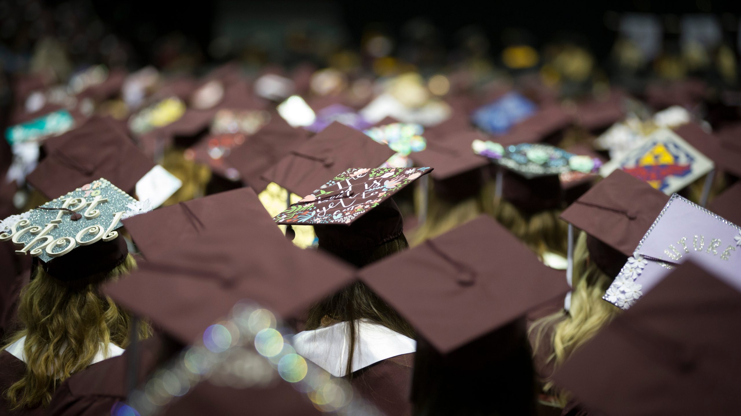 Decorated grad caps during commencement